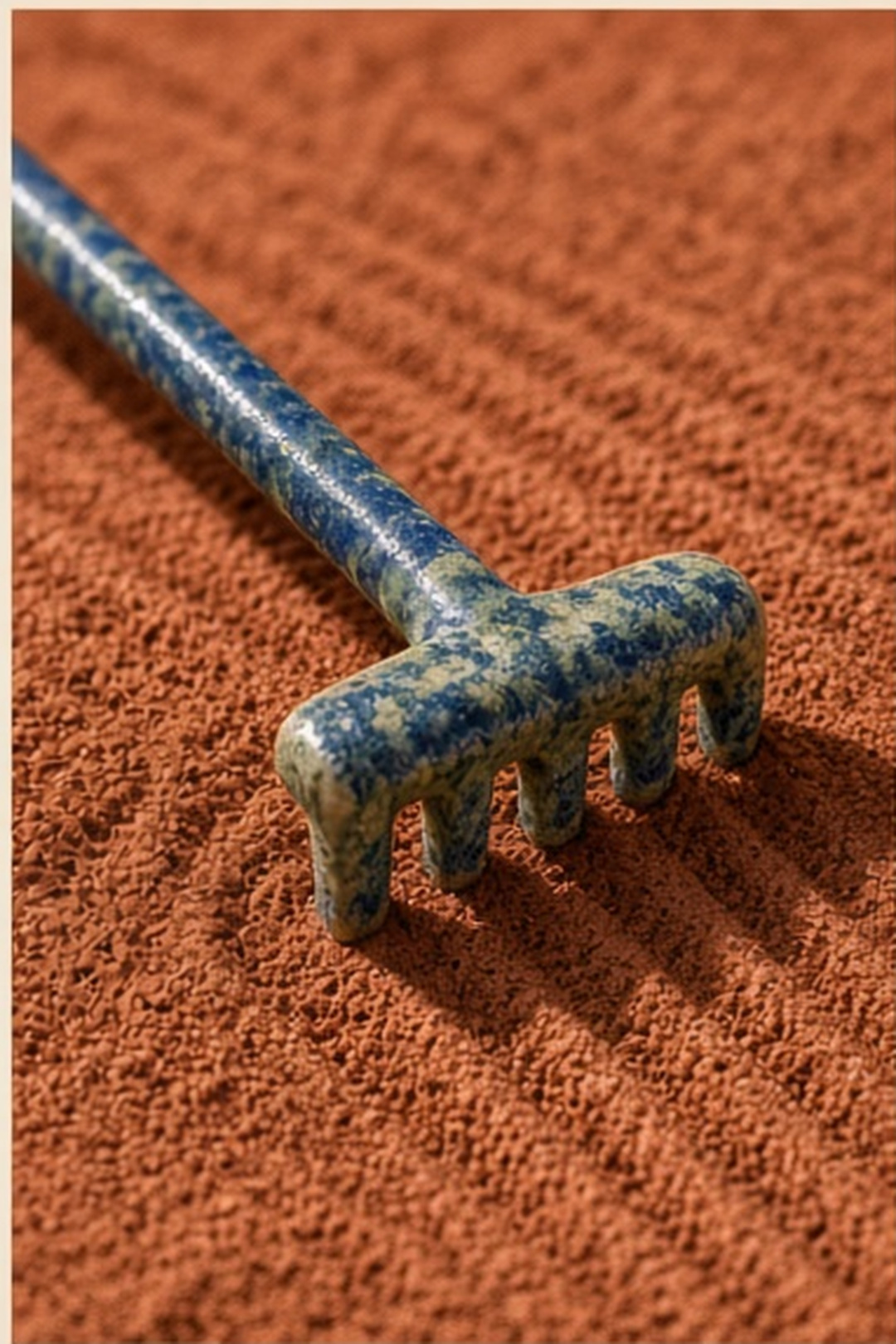 One ceramic tile being lifted from a tray